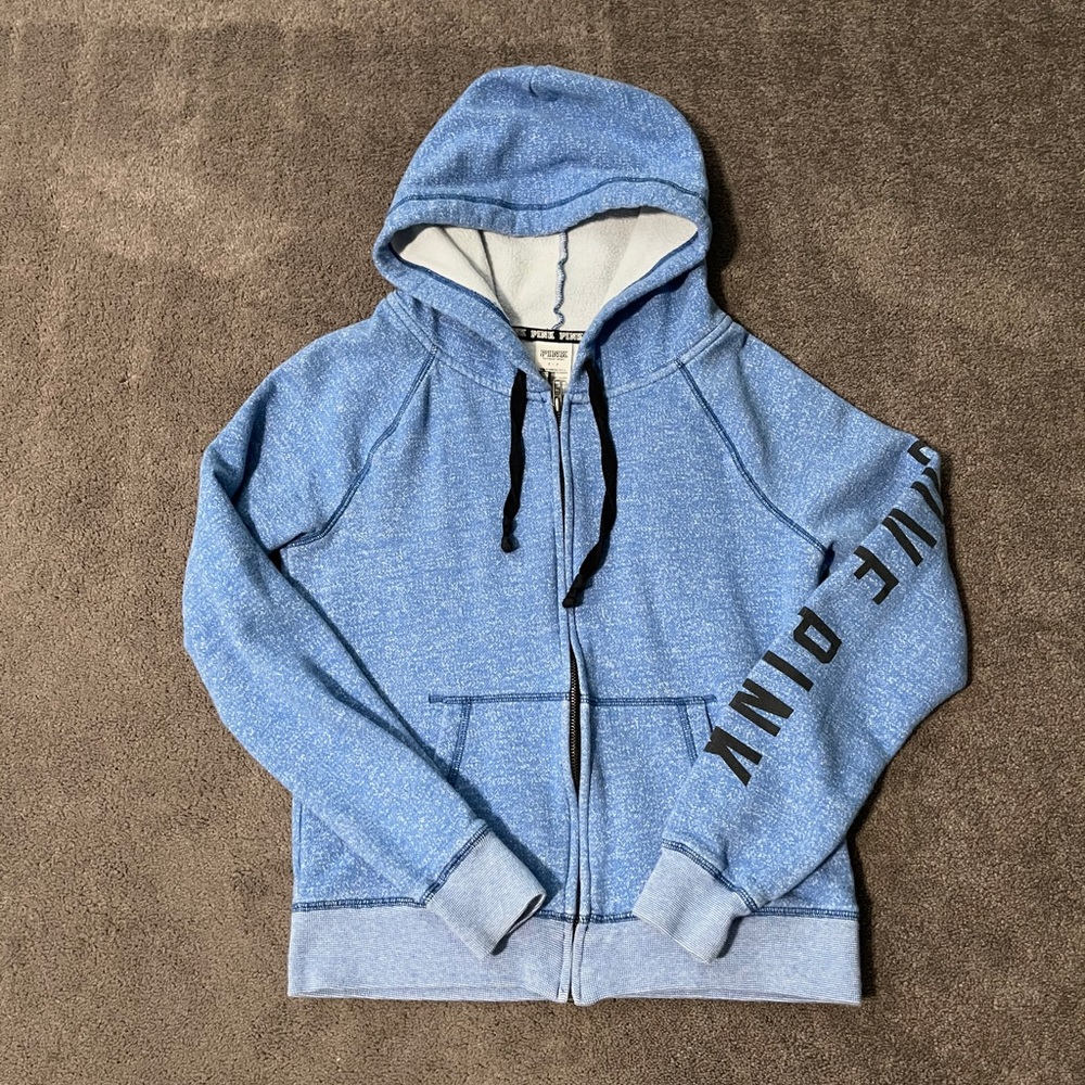 Pink zip up hoodie.